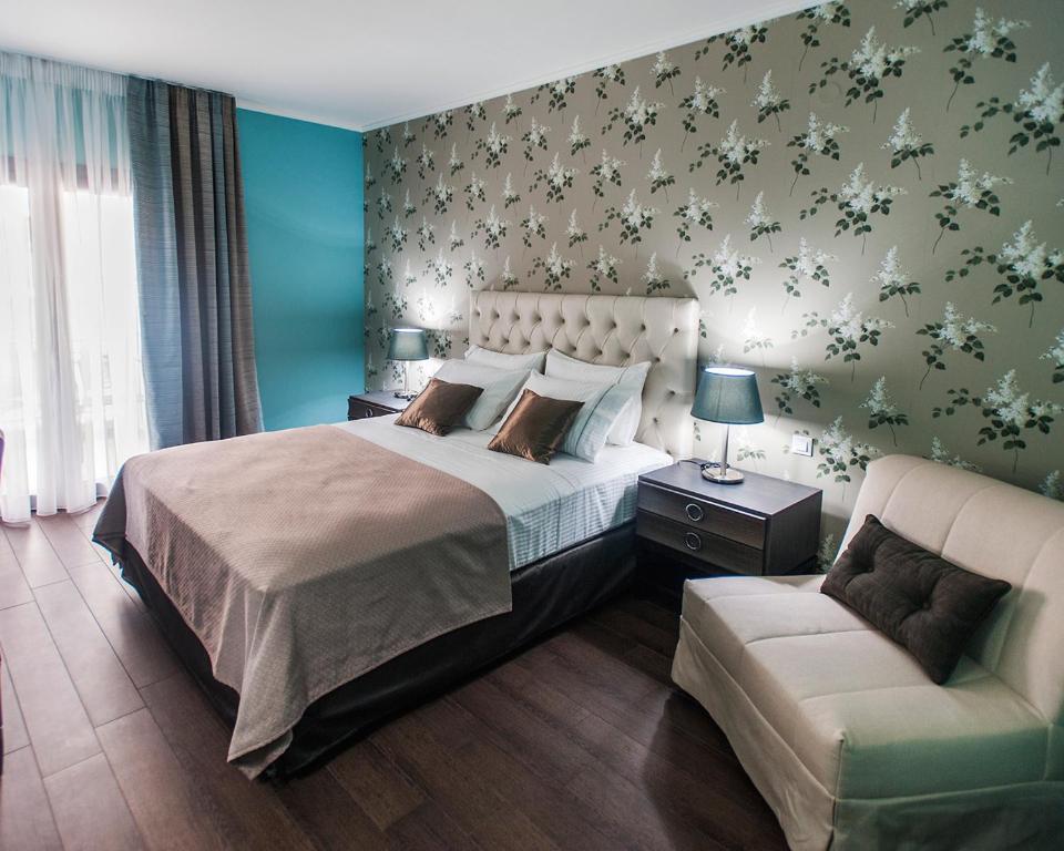 Postel nebo postele na pokoji v ubytování Theasis Hotel Paramythia