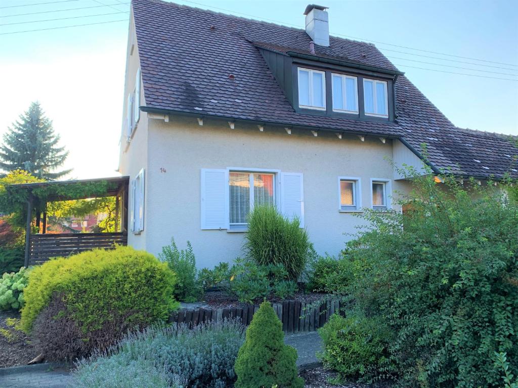 a house with a garden in front of it at BodenSEE Holiday Home Eriskirch in Eriskirch