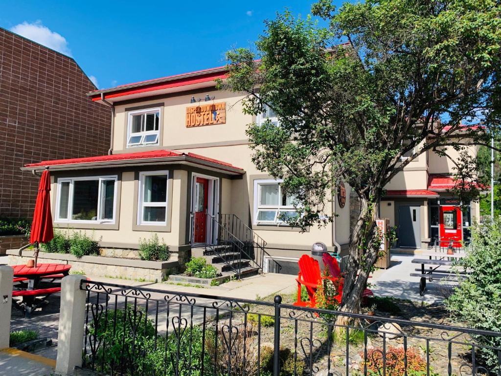 a house with a table and chairs in front of it at Jasper Downtown Hostel in Jasper