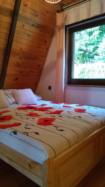 Postel nebo postele na pokoji v ubytování Domek całoroczny Tresna Agata