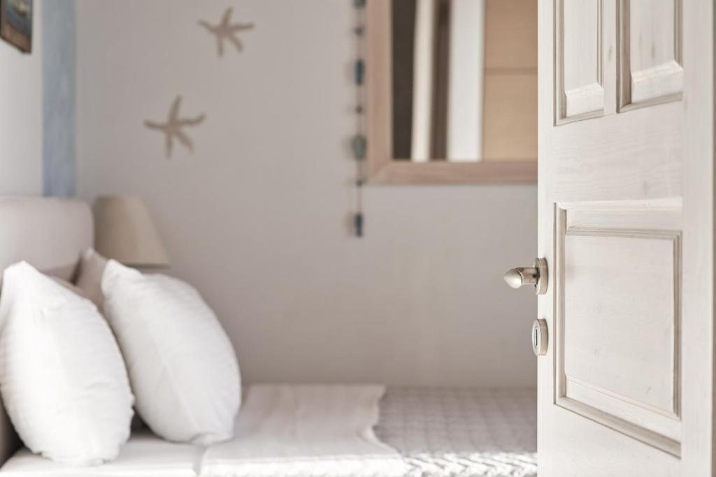 Postel nebo postele na pokoji v ubytování Paradisia Villas