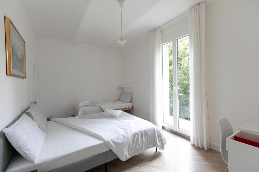 Posteľ alebo postele v izbe v ubytovaní Saragozza Apartments