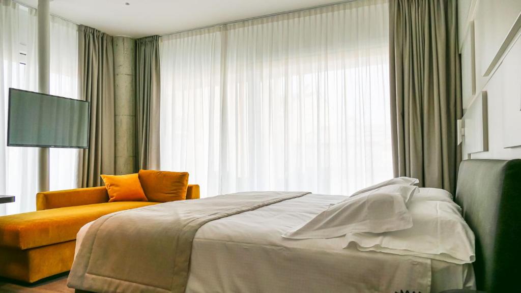 Postel nebo postele na pokoji v ubytování Solho Hotel