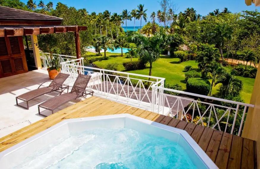 a hot tub on the deck of a house at Penthouse Las Playas in Las Terrenas