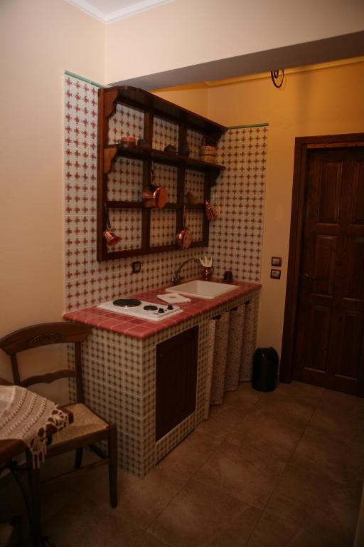 Kuchyň nebo kuchyňský kout v ubytování Roes Suites