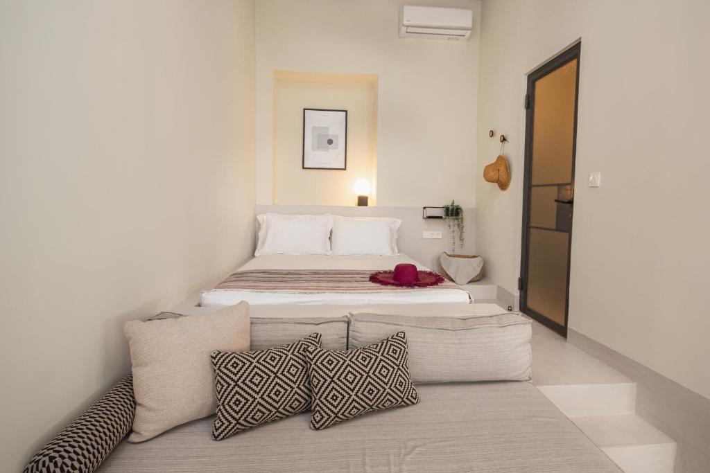 Postel nebo postele na pokoji v ubytování Pyli Apartments