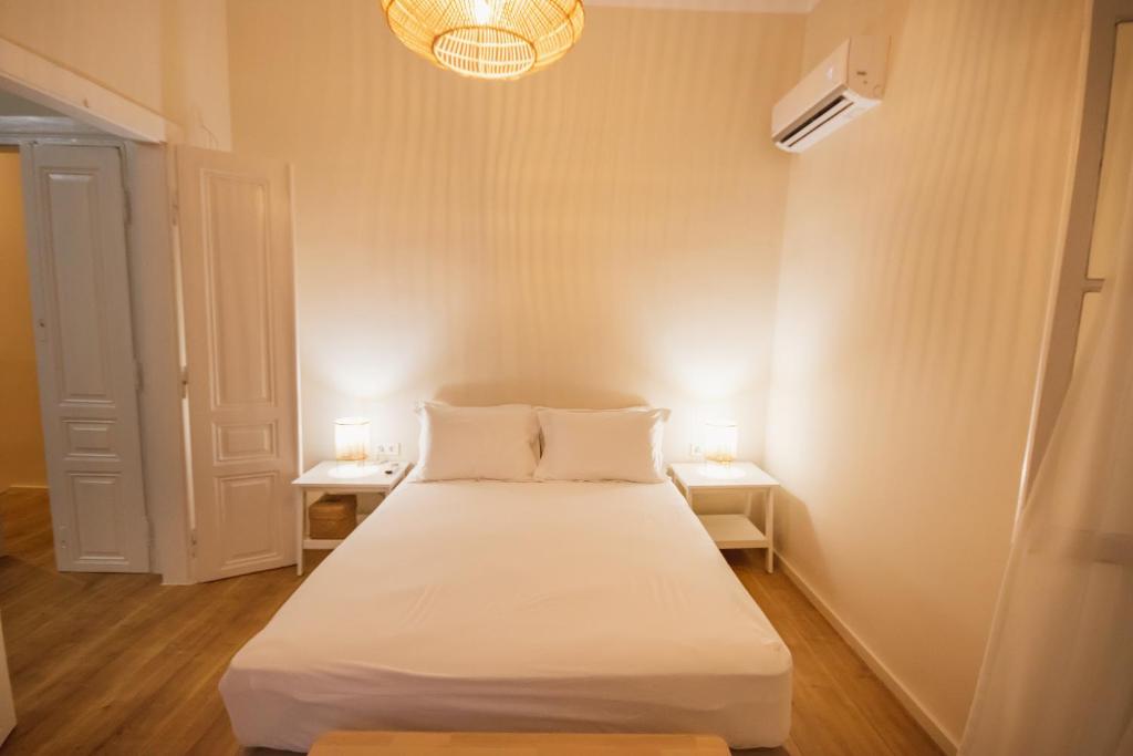 Postel nebo postele na pokoji v ubytování Pyli Apartments