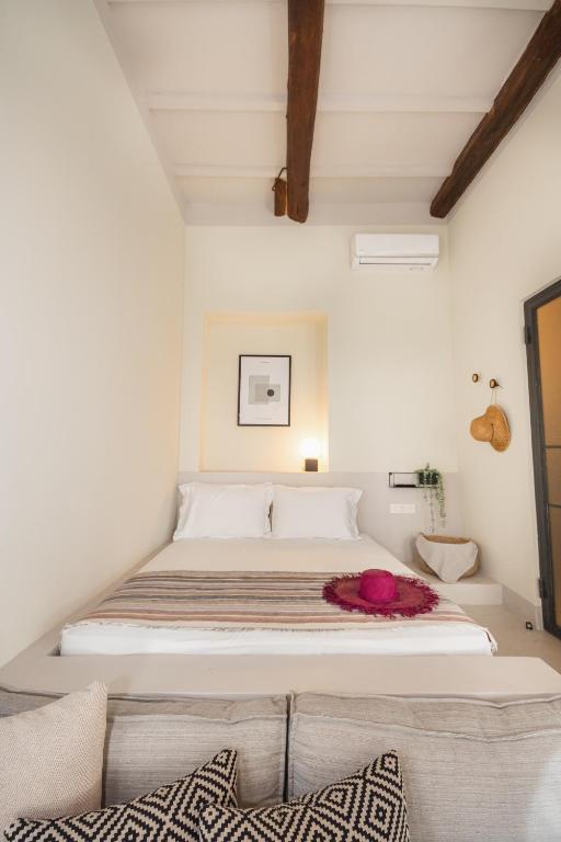 Postel nebo postele na pokoji v ubytování Pyli Apartments