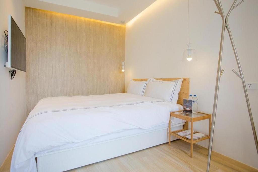 Postel nebo postele na pokoji v ubytování Mini West Hotel