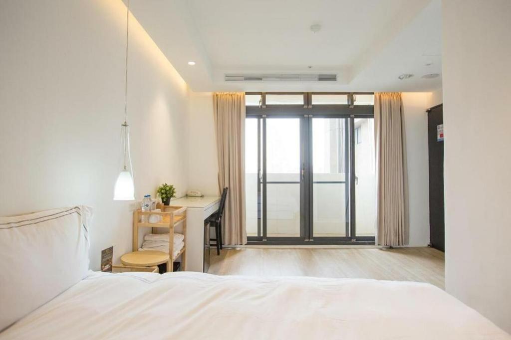 Postel nebo postele na pokoji v ubytování Mini West Hotel