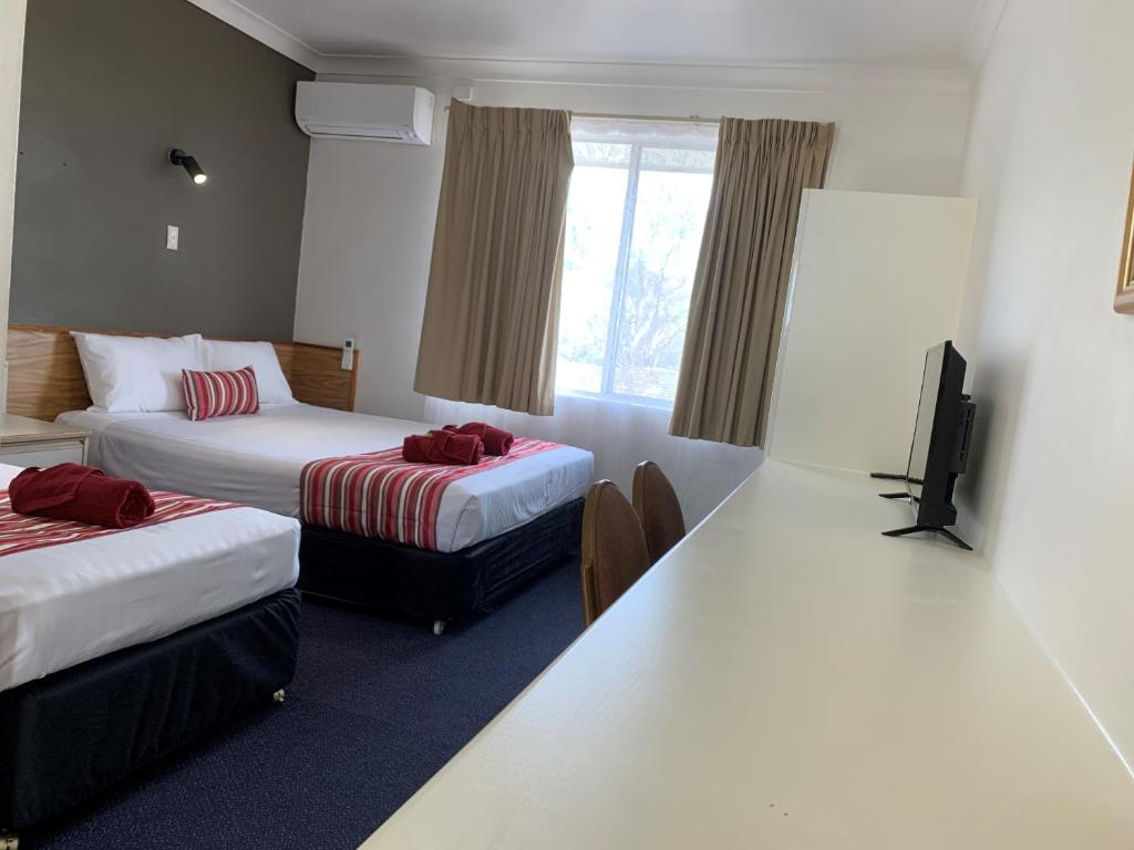 Postel nebo postele na pokoji v ubytování Panorama Motor Inn