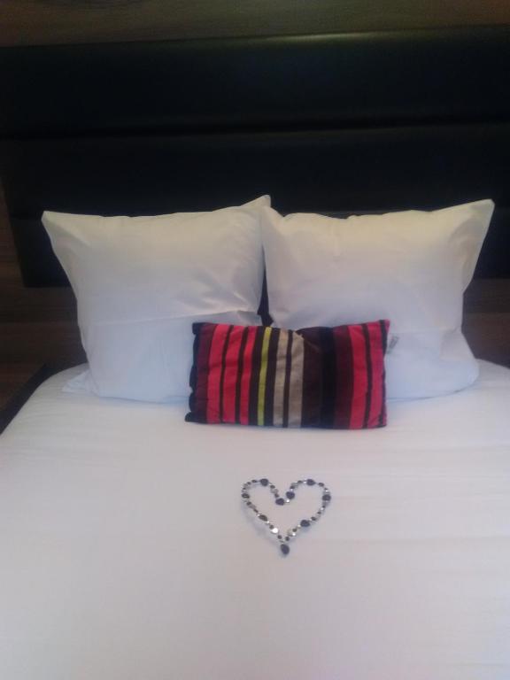 Postel nebo postele na pokoji v ubytování Hotel Morez