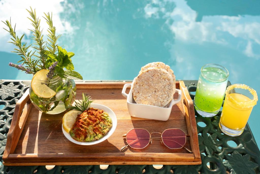 a tray of food and drinks and a tray of food at Brooklyn Manor in Pretoria