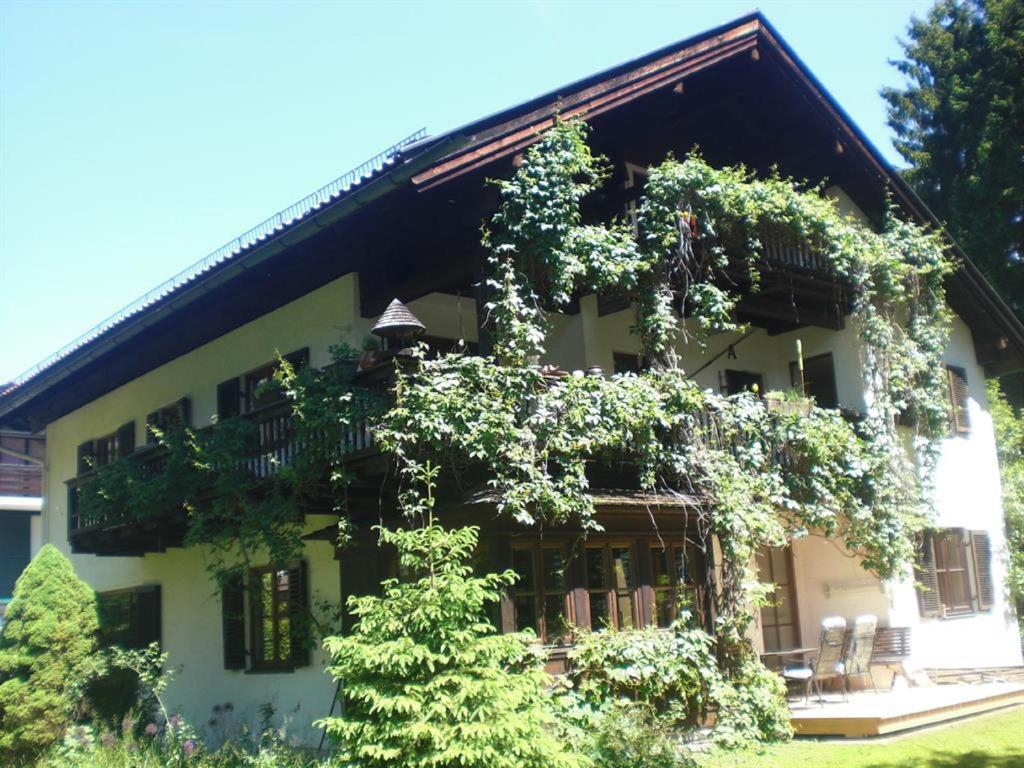 a building with plants on the side of it at Ferienwohnung Angie in Garmisch-Partenkirchen