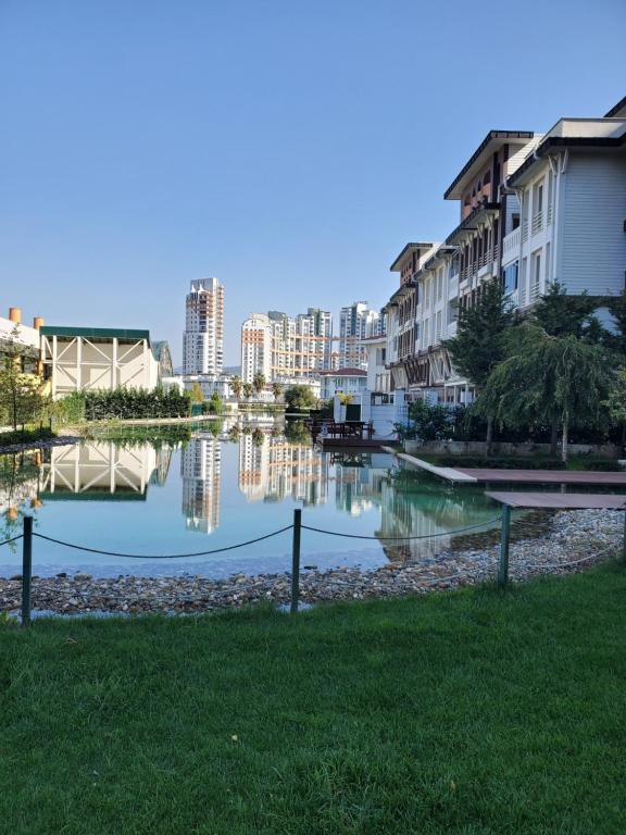 a view of a river with buildings in the background at Hallmark Bursa in Bursa