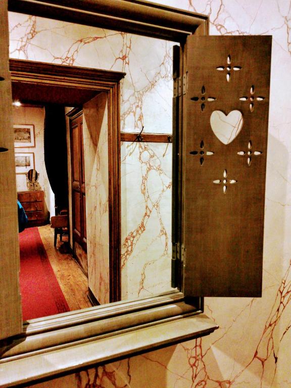 Postel nebo postele na pokoji v ubytování Les chambres d'hôtes du Manoir de Roz-Maria