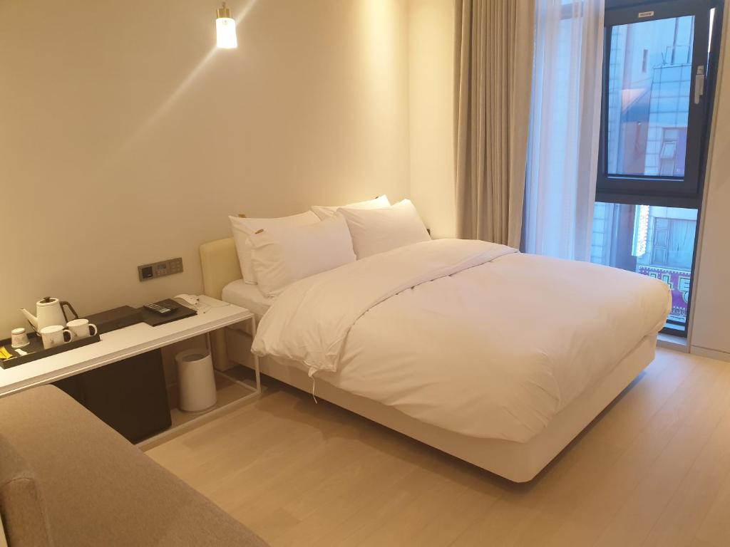Postel nebo postele na pokoji v ubytování Hotel Libre
