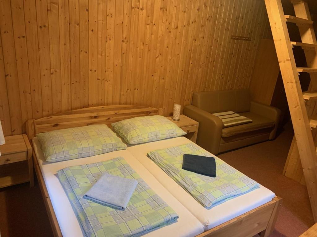 Postel nebo postele na pokoji v ubytování Kamenný Mlýn