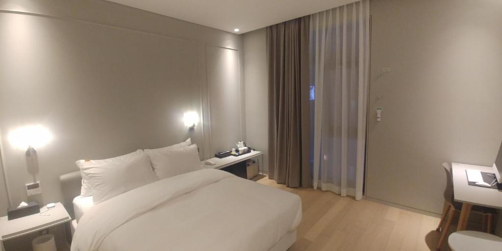Postel nebo postele na pokoji v ubytování Hotel Libre