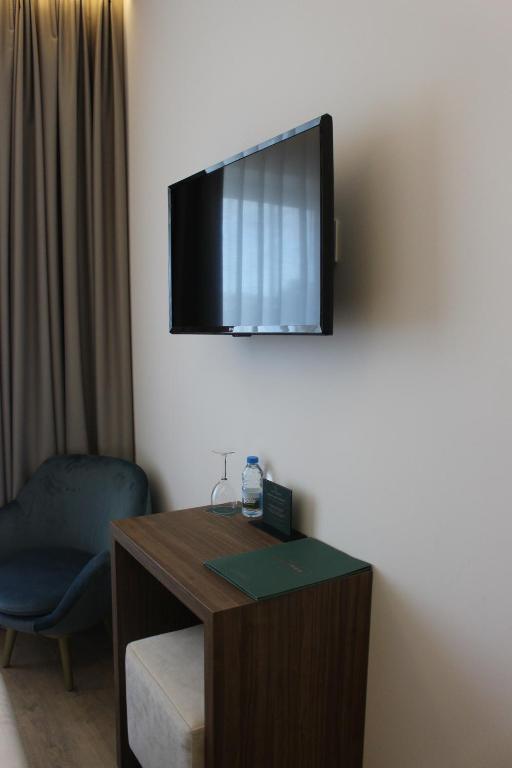TV a/nebo společenská místnost v ubytování Hotel Moutados