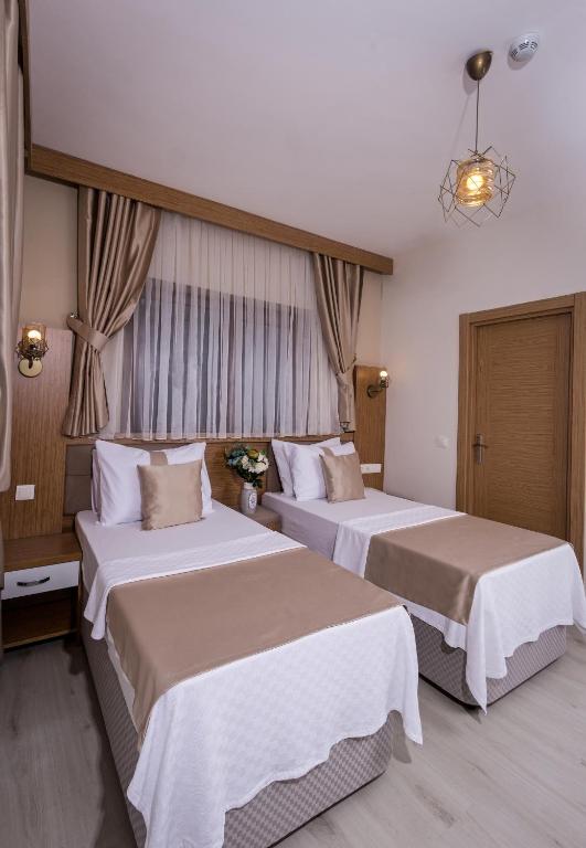 Postel nebo postele na pokoji v ubytování Zeyn Otel Istanbul