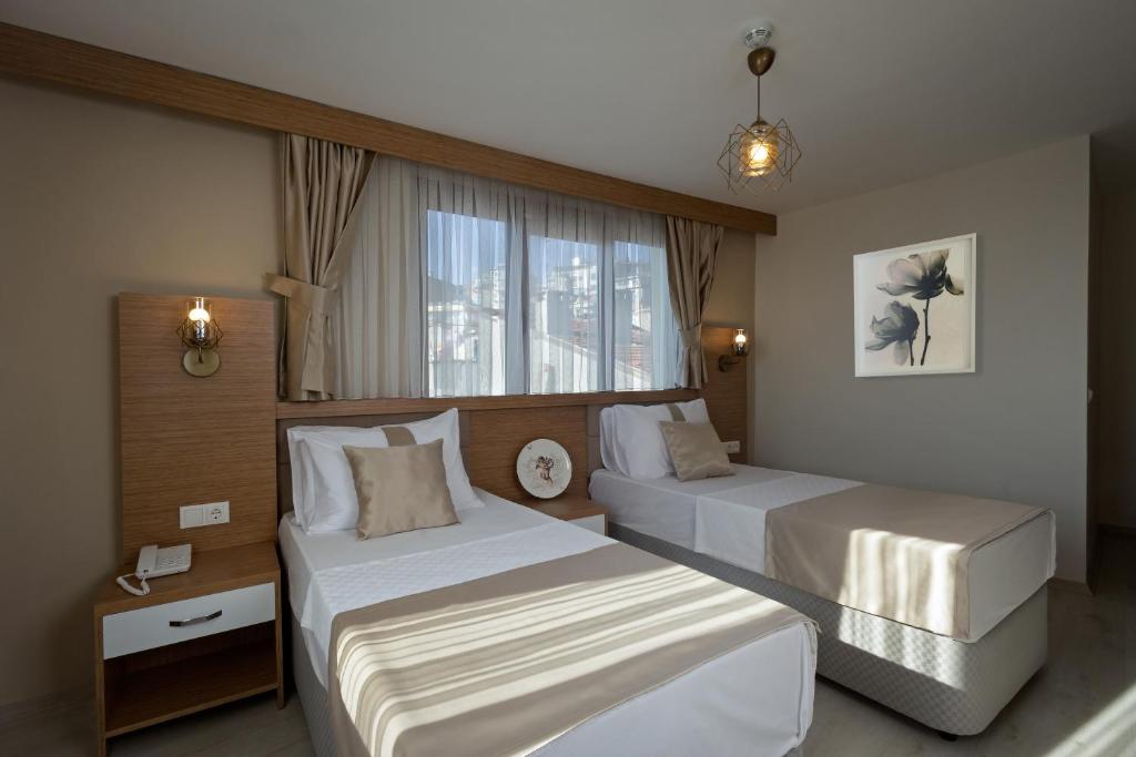 Giường trong phòng chung tại Zeyn Otel Istanbul