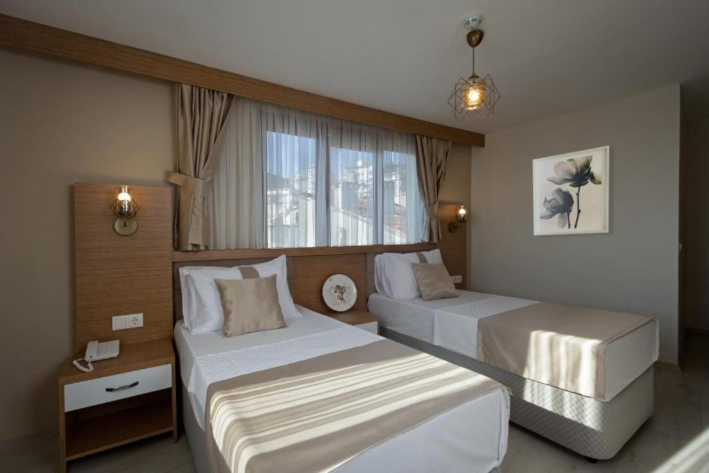 Postel nebo postele na pokoji v ubytování Zeyn Otel Istanbul