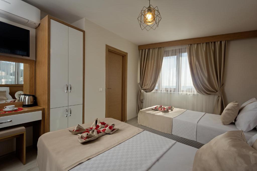 Postel nebo postele na pokoji v ubytování Zeyn Otel Istanbul