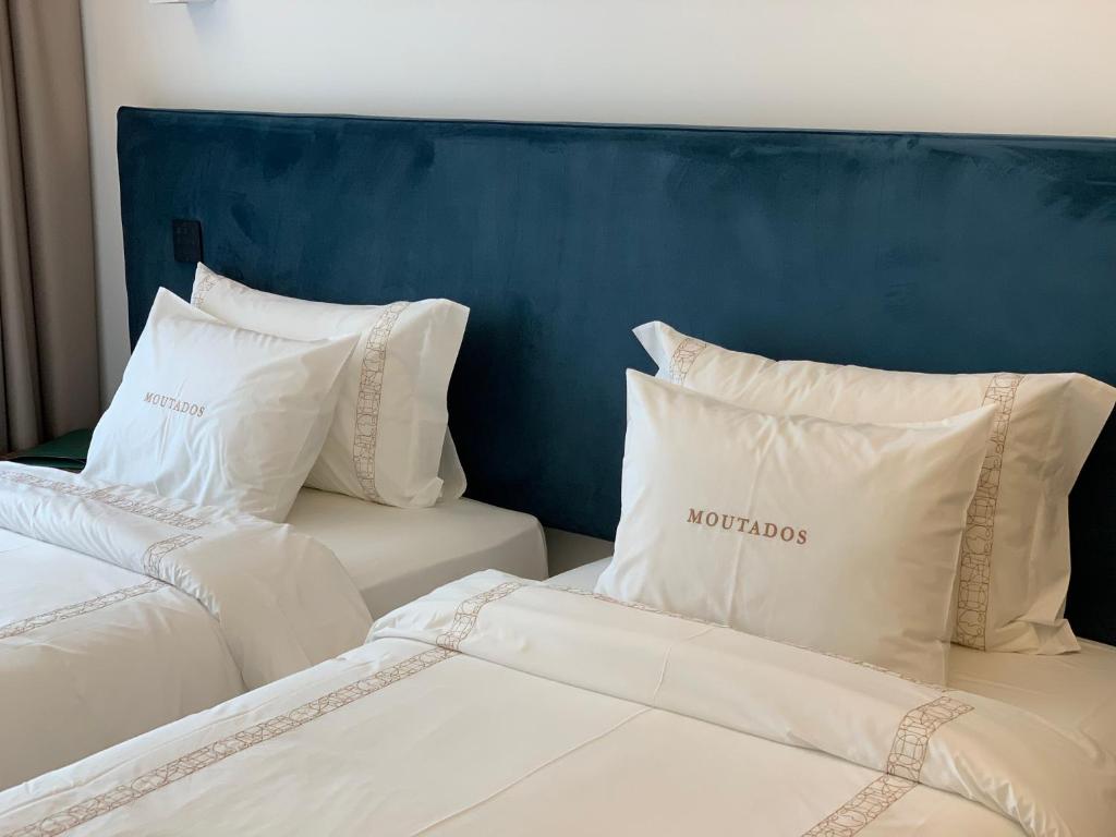 Postel nebo postele na pokoji v ubytování Hotel Moutados
