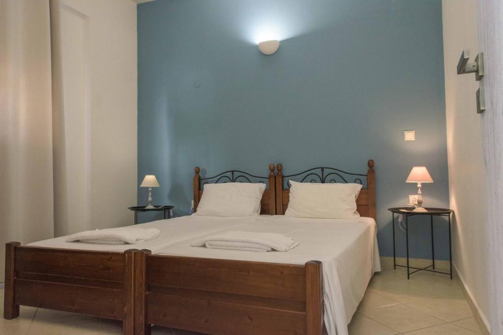 Postel nebo postele na pokoji v ubytování Pasithea apts