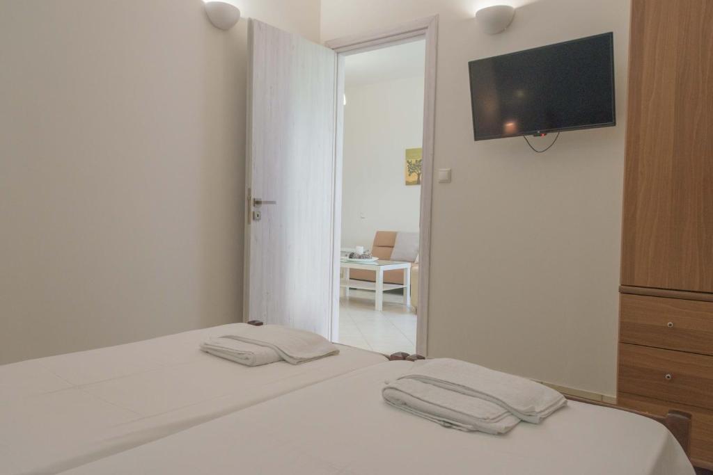 Postel nebo postele na pokoji v ubytování Pasithea apts