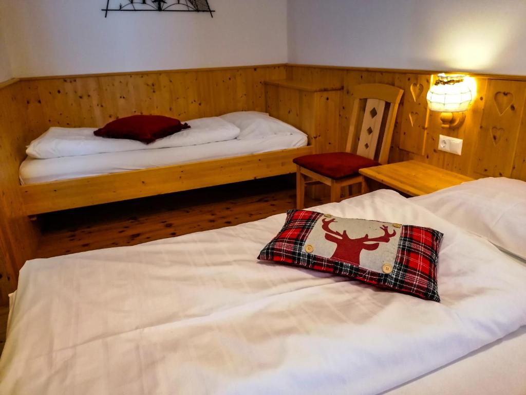 A bed or beds in a room at Appartement Bel Monte - Kärnten Card Sommer inklusive