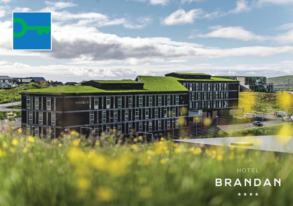 a rendering of a building with a green roof at Hotel Brandan in Tórshavn
