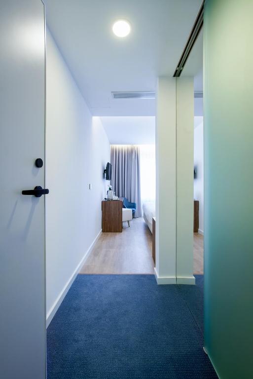 Postel nebo postele na pokoji v ubytování Hotel Moutados