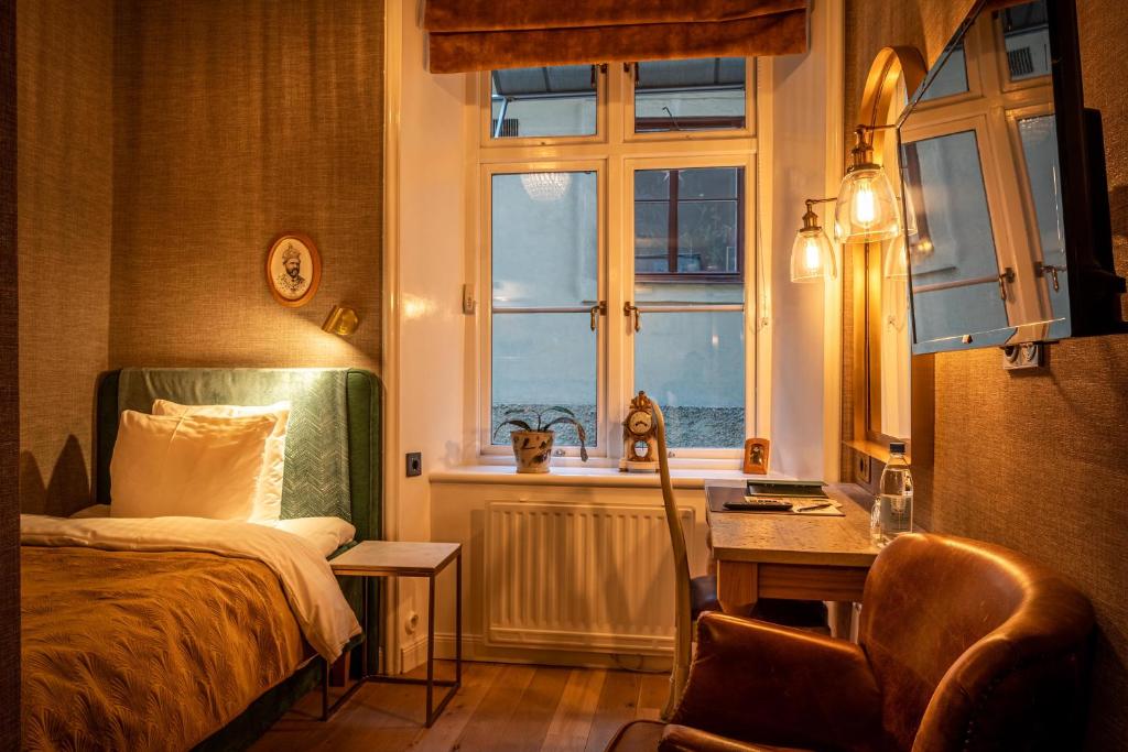 Postel nebo postele na pokoji v ubytování Victory Hotel