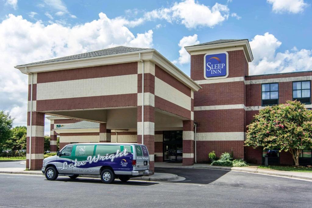 a van parked in front of a store at Sleep Inn Lake Wright - Norfolk Airport in Norfolk