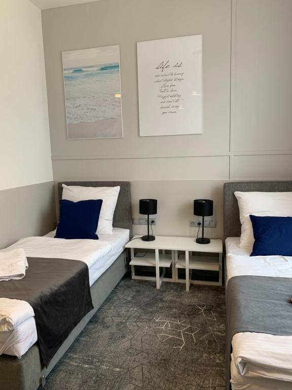 Postel nebo postele na pokoji v ubytování Hotel Coliber