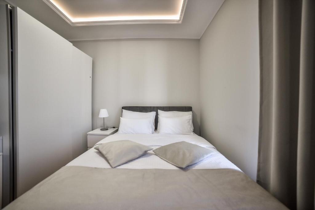 Postel nebo postele na pokoji v ubytování Centar apartmani Zlatibor