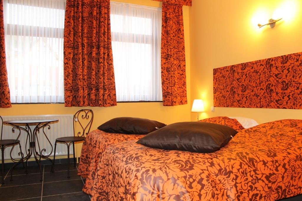 Postel nebo postele na pokoji v ubytování Hotel Le Relais de Pommard
