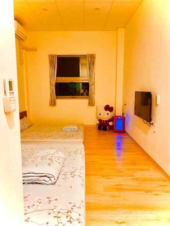 Postel nebo postele na pokoji v ubytování 枋山六號