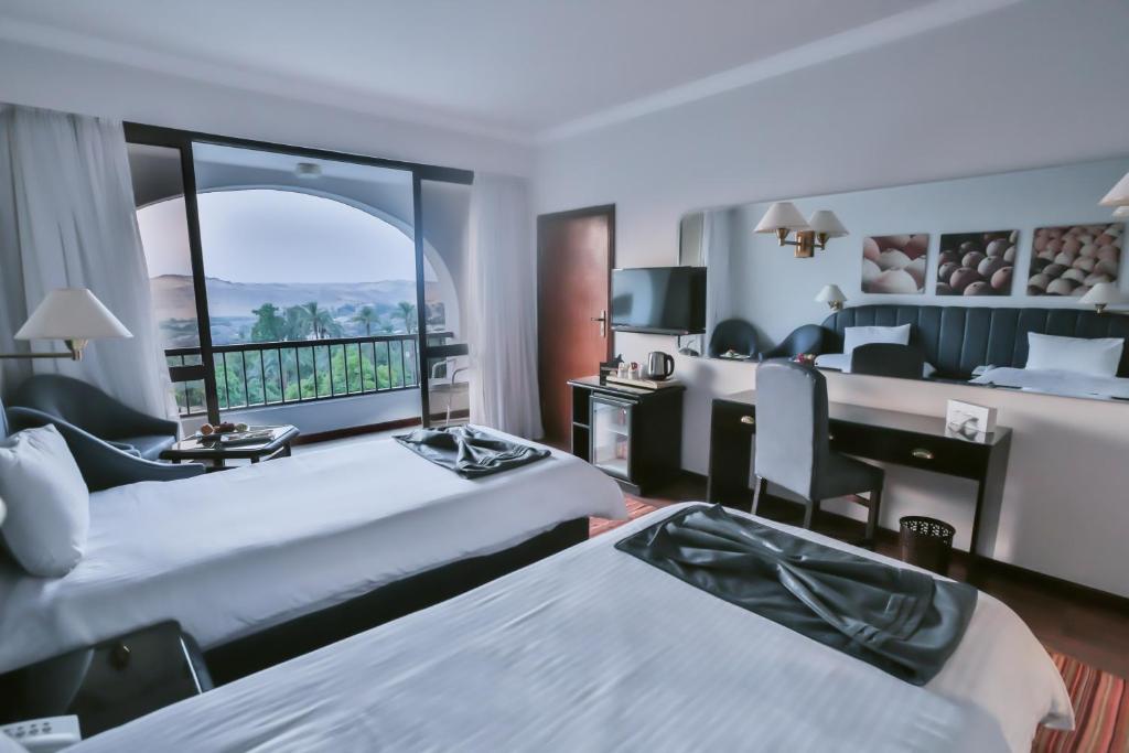 Llit o llits en una habitació de Basma Hotel Aswan