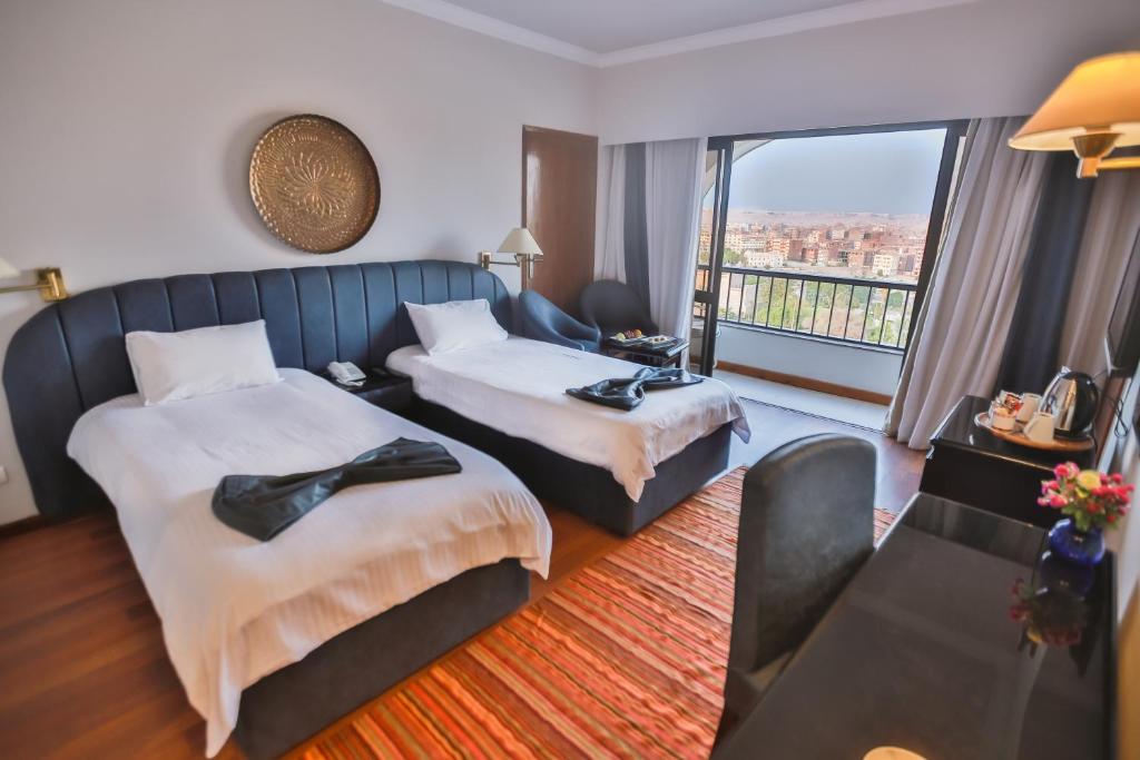 Llit o llits en una habitació de Basma Hotel Aswan
