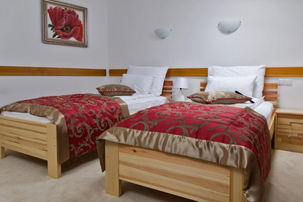 Postel nebo postele na pokoji v ubytování Hotel Berr