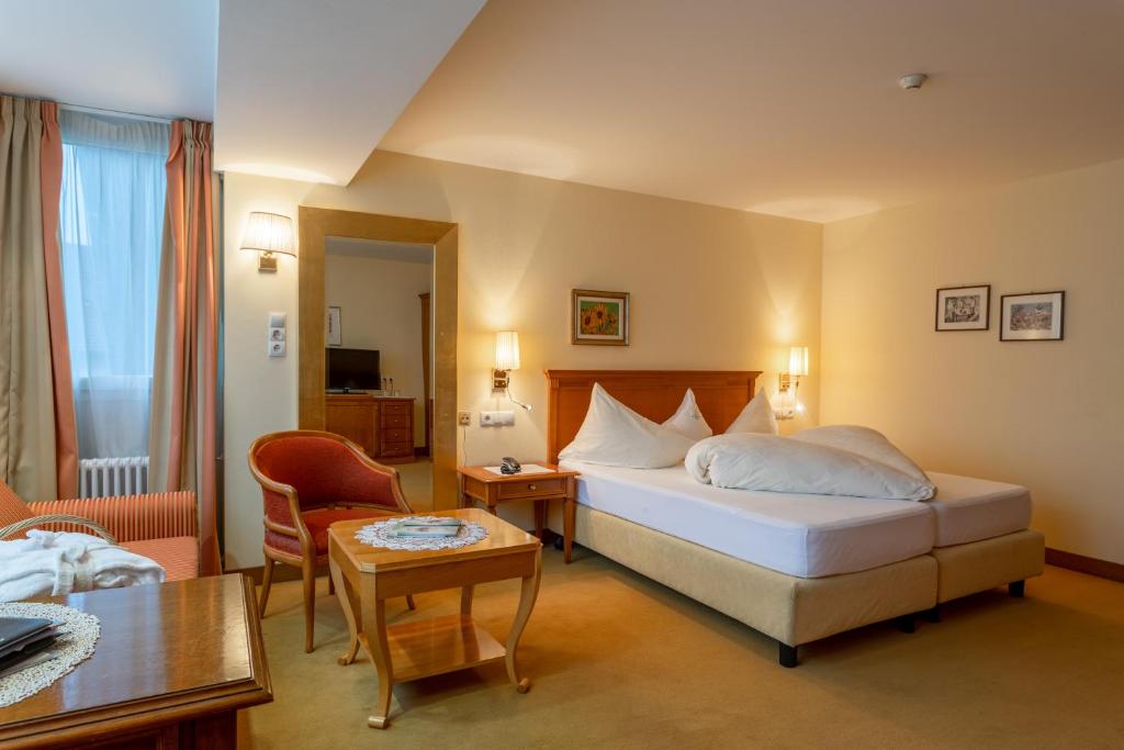 Postel nebo postele na pokoji v ubytování Hotel Bemelmans-Post