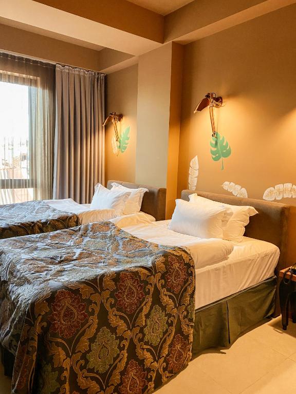 Postel nebo postele na pokoji v ubytování Brim Hotel