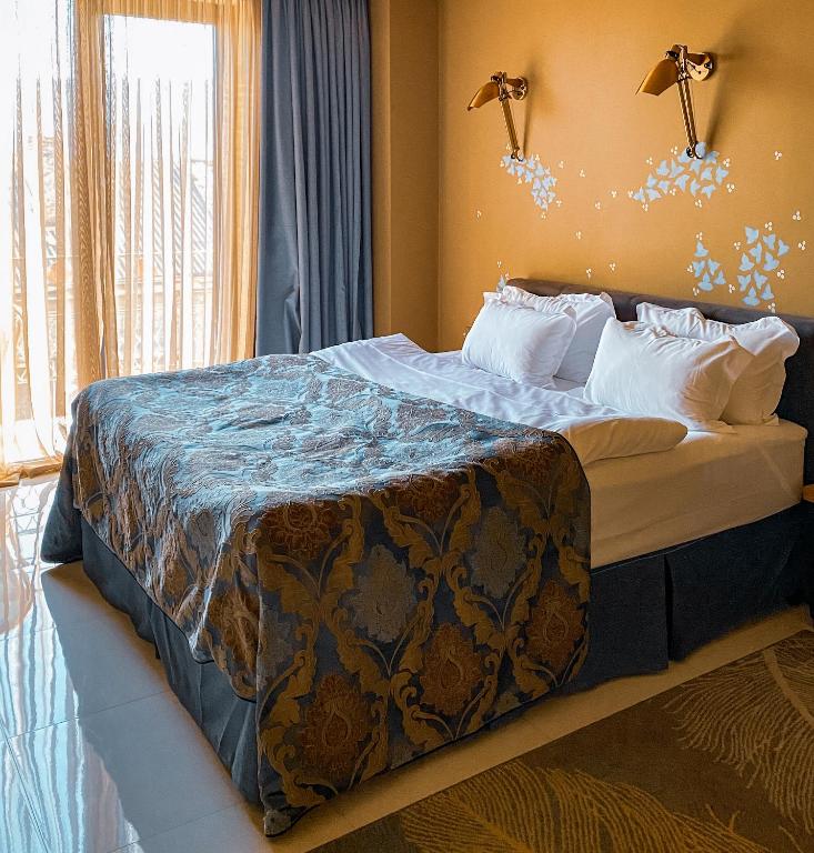 Postel nebo postele na pokoji v ubytování Brim Hotel