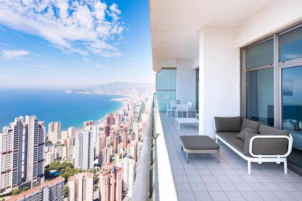 a balcony of a building with a view of the ocean at Luxury apartment on the 41st floor with stunning sea views in Benidorm