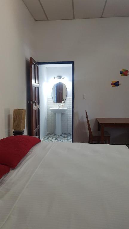 Ein Bett oder Betten in einem Zimmer der Unterkunft Tapihouse