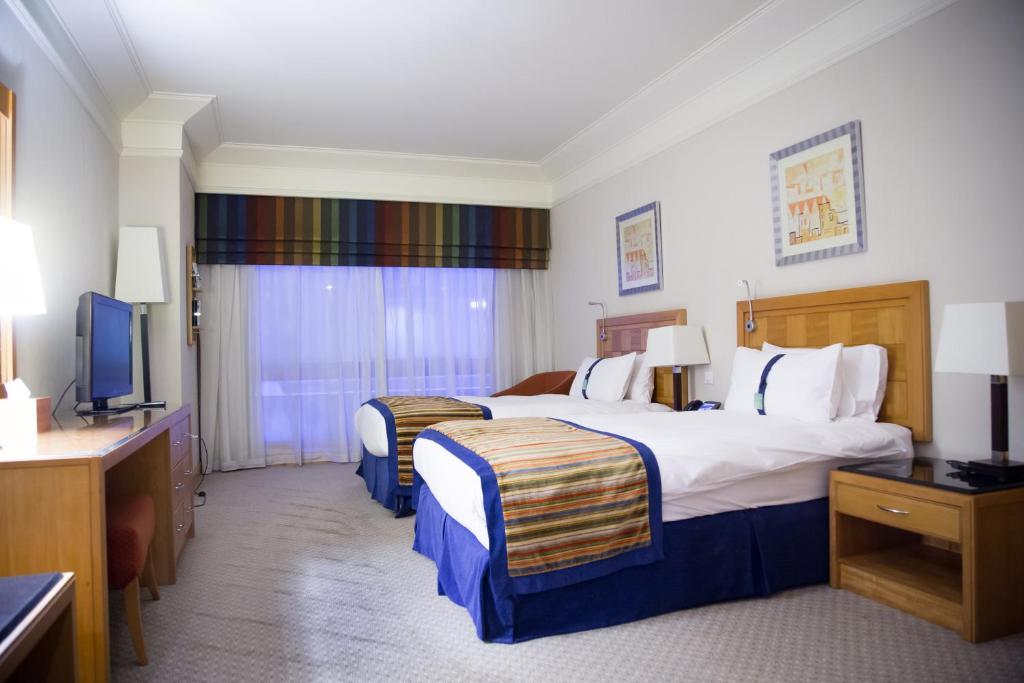 Postel nebo postele na pokoji v ubytování Holiday Inn Citystars by IHG