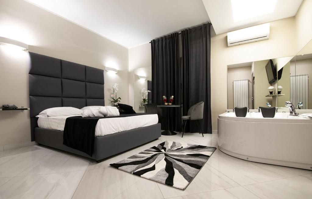 Postel nebo postele na pokoji v ubytování Hotel Trionfal